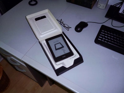 kindle e-reader with packaging open on desk